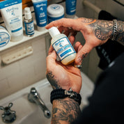 Close-up of Maestro’s Classic Mark of a Man Beard Wash bottle showing refined label design and premium packaging.